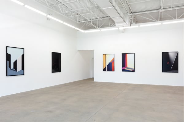 installation view of photographs by Popel Coumou