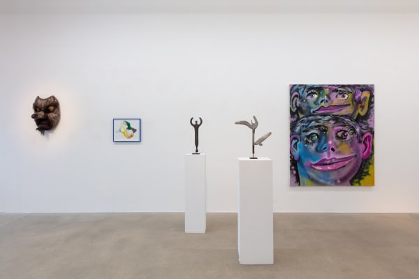 installation view of A Path Less Traveled, featuring historical ethnographic work and contemporary art