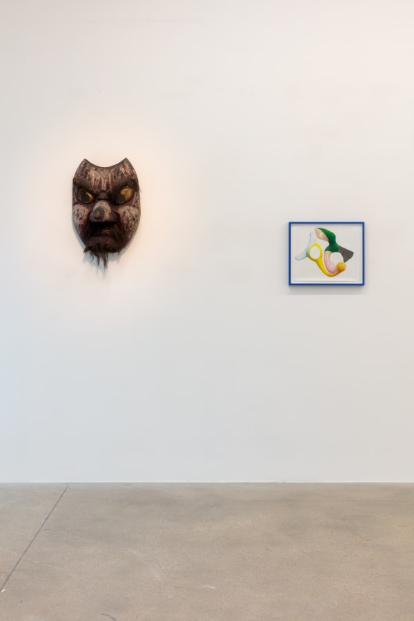 installation view of A Path Less Traveled, featuring historical ethnographic work and contemporary art