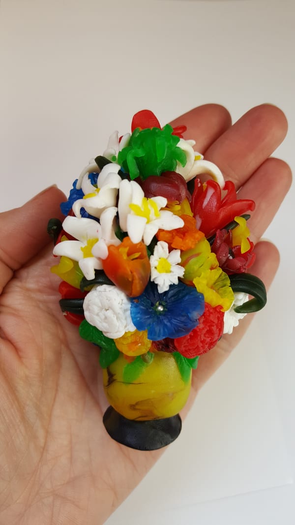 artist holding her sculpted flowers