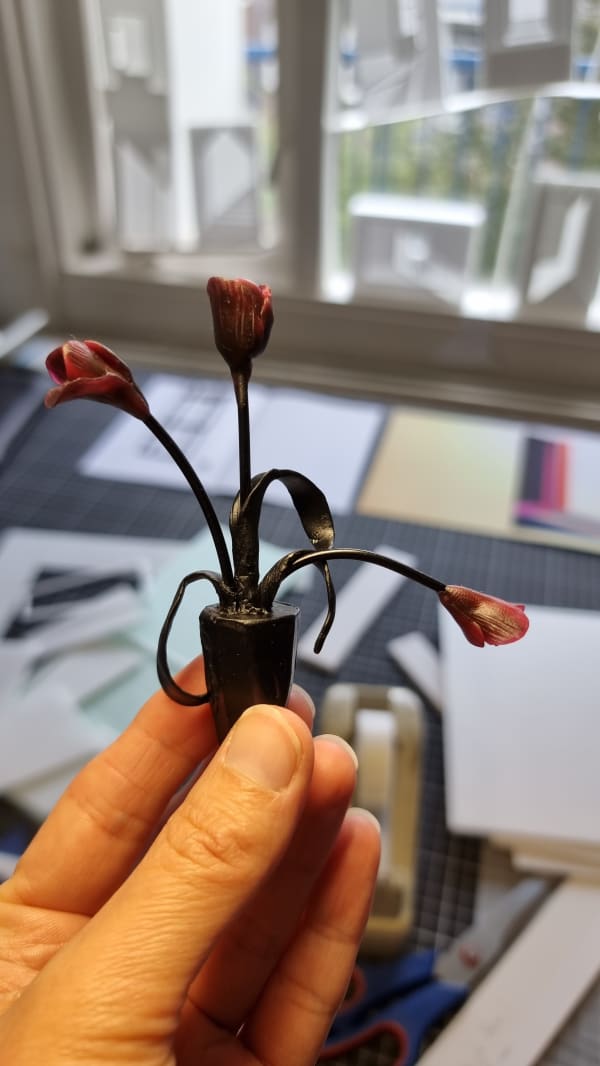 artist holding her sculpted flowers