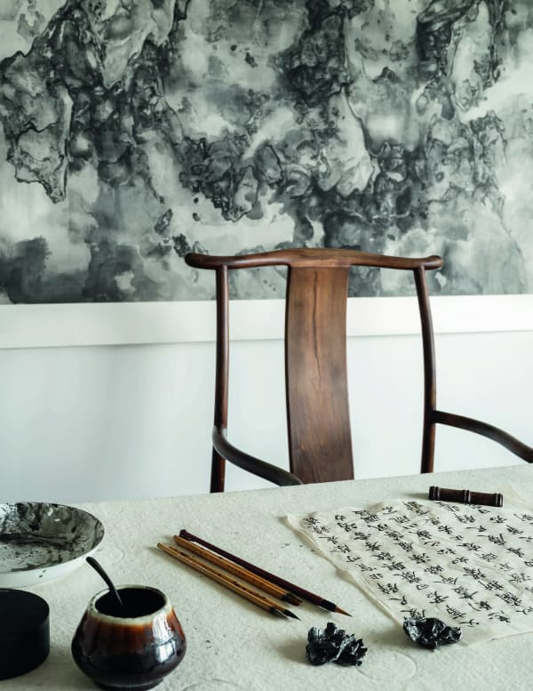 Tai Xiangzhou's studio, with paintings hanging on the wall