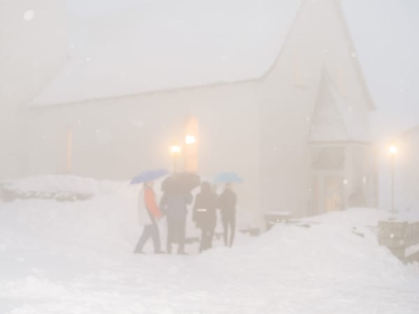 Crowds marching in the snowy night