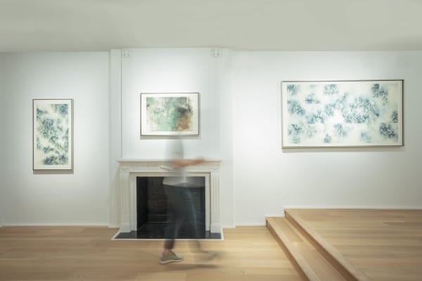 fuqiumeng gallery wall with a man walking past.