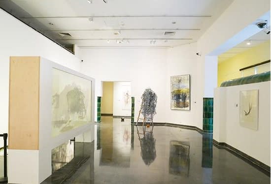 A picture containing indoor, gallery, scene, wall