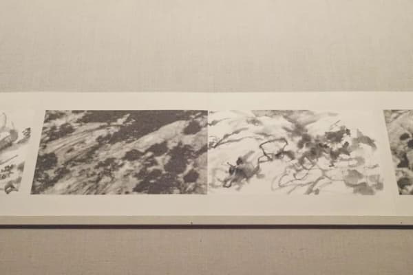 A picture containing ink painting on the right and black and white photography on the left, abstract line, depicts mountain 