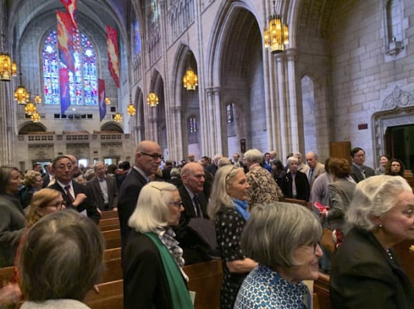 A group of people in the church, remembering Fang Wen