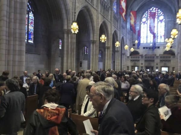 A group of people in the church, remembering Fang Wen