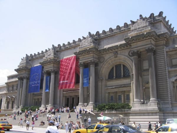 A front view of the Metropolitan Museum of Art, where you can see the frolicking crowd
