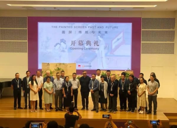 A group of people standing on a stage