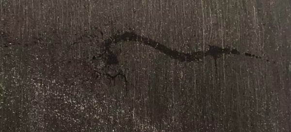 a close-up of the black painting