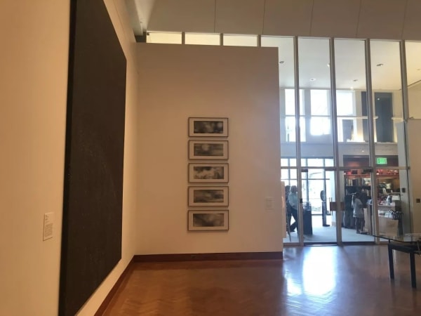 the installation of the museum, Five black and white works hanging vertically on the wall