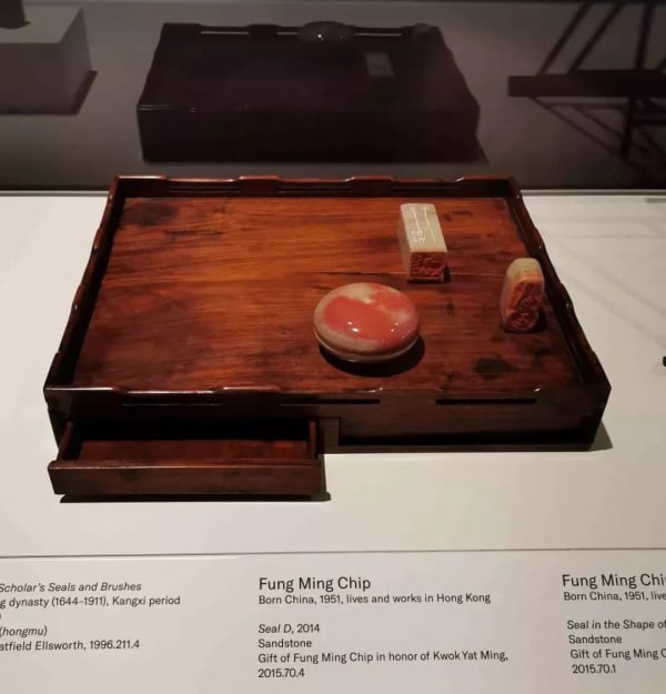 Seal engraving on a wooden pallet on display