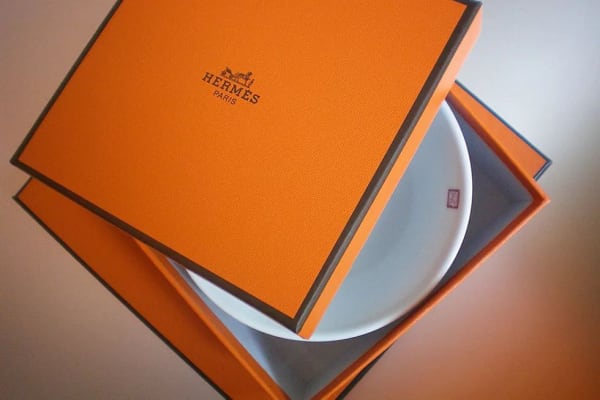 An orange box with a white plate inside