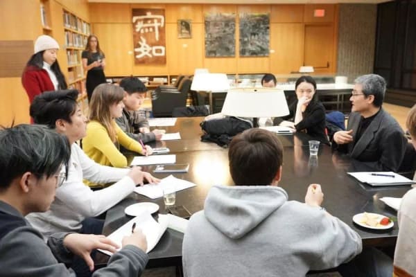 A group of people sitting around a table