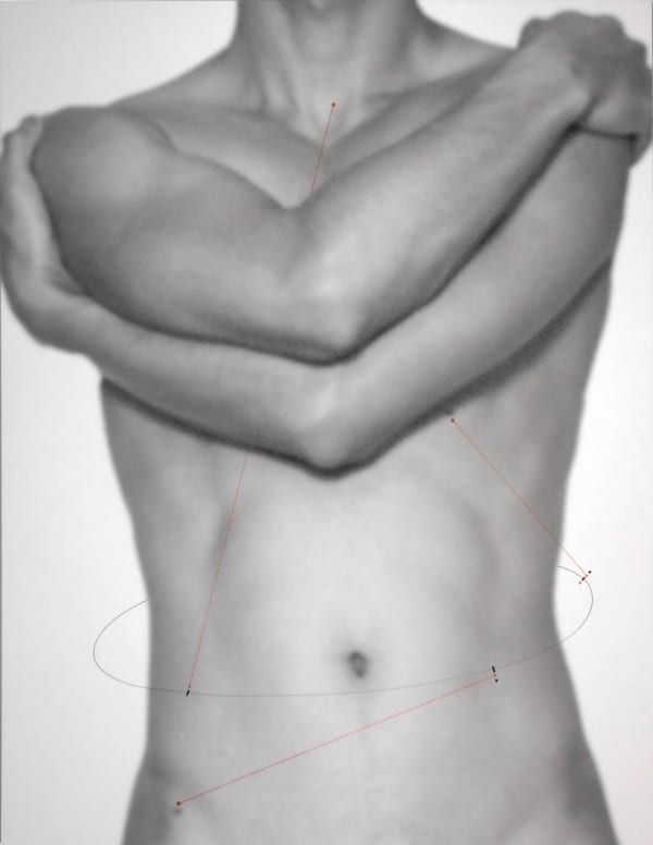 Torso of a man with his arms wrapped around his chest