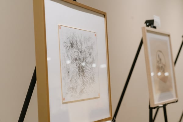 Two works on a stand