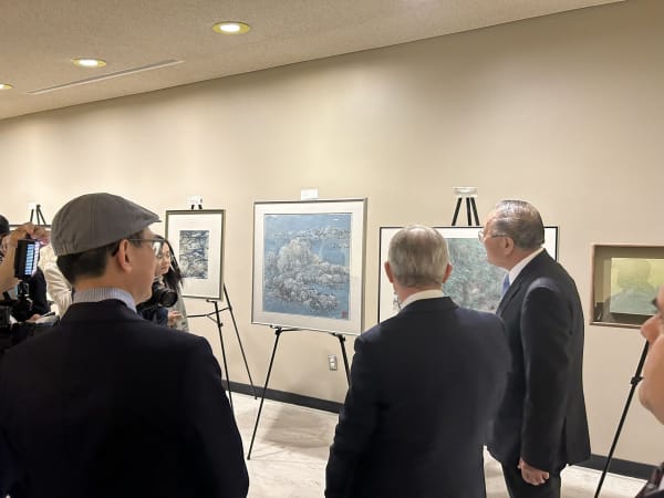 A group of people looking at art