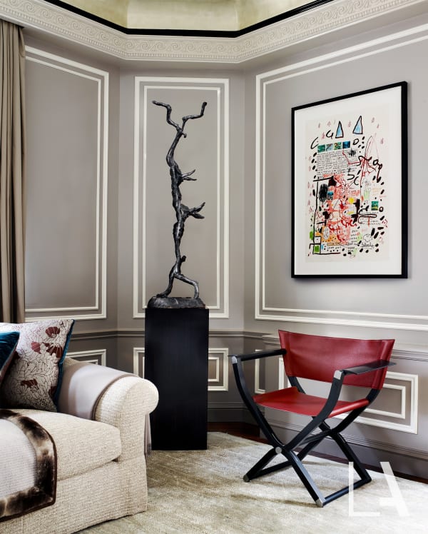 A sculpture by Barry Flanagan (Irish-Welsh 1941-2009) with a work by Jean -Michel Basquiat (American, 1960-1988). Private Collection. Courtesy Lovell Art Advisory.
