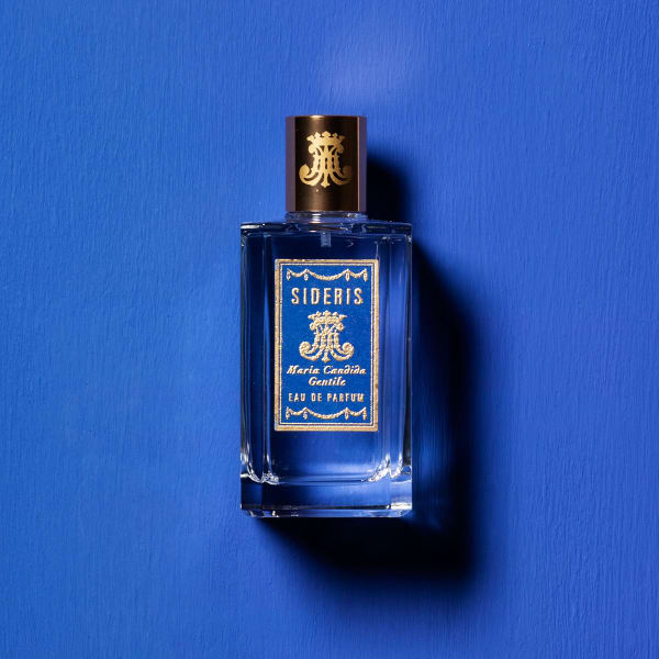 Perfume bottle SIDERIS by Maria Candida Gentile against a brown background