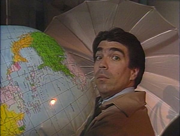 Still from Michael Smith and William Wegman, The World of Photography, 1986