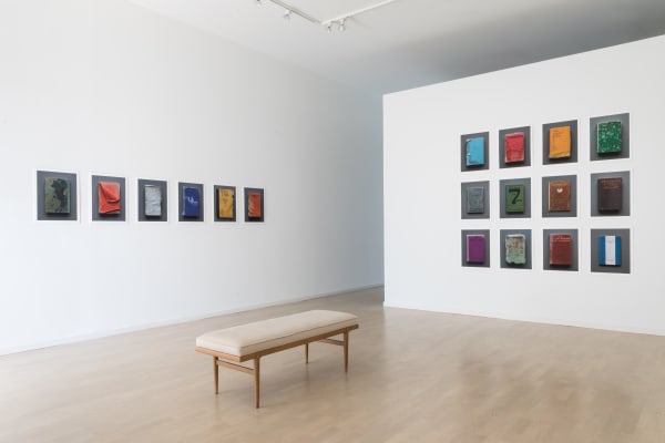 Nine Mary Ellen Bartley books from her series "Reading Grey Gardens," displayed three by three in rows to the right, and six "Reading Grey Gardens" books across on the left.