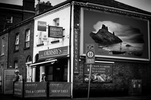 During the Covid - 19 First Lockdown in Dublin City, Ireland. A virtual image on an advertising billboard, in an empty city street. Images from Eamonn Farrell's The Naked City Virtual Exhibition for Dublin Culture Night 2020.