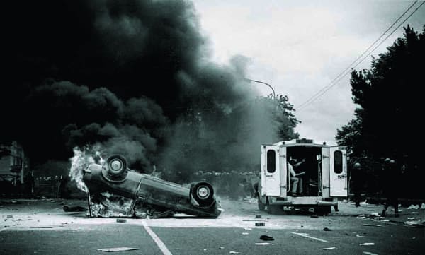 British Embassy Riot. The scene of devastation on the Merrion Road in Dublin, after H-Block/Hunger Strike marchers attempted to storm a garda barricade preventing them marching on the British Embassy. 18/7/1981. Photo: © Eamonn Farrell.