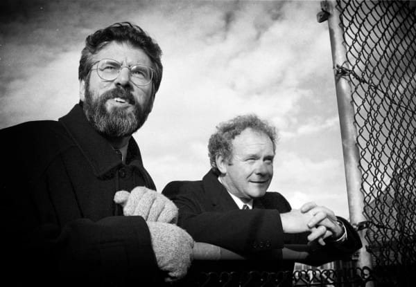 Good Friday/Belfast Historic Agreement. L TO R. Sinn Fein President Gerry Adams and Chief Negotiator Martin McGuinness, look over the wire in Stormont Castle at lunch time, after indicating their final approval of the Good Friday (Belfast Agreement) peace agreement. 10/4/1998 Photo: © Eamonn Farrell