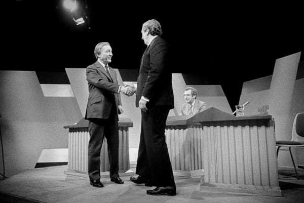Historic TV Leadership Debate. Left to Right. Fianna Fail leader Charles Haughey shakes hands with Taoiseach and Fine Gael leader Dr. Garret Fitzgerald, for the first ever Leaders TV General Election Debate, RTE, Dublin, Ireland. 16/2/1982. Photo: © Eamonn Farrell.