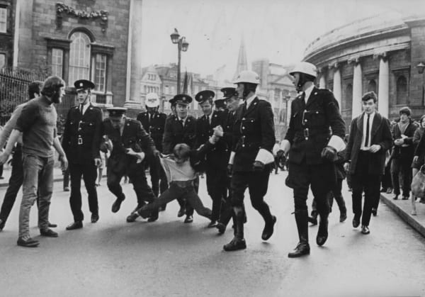 Eamonn Farrell, then Secretary of the Dublin Housing Action Committee (DHAC), is arrested by Gardai (Irish police), during a housing protest in College Green in Dublin City Centre. 30/9/1969. Author Unknown.