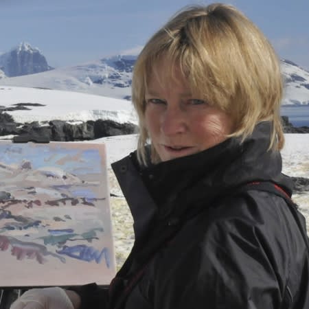 Photo of the artist painting in Antarctica