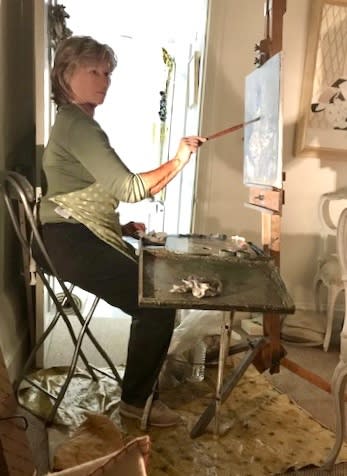 Photo of the artist Susan Ryder painting