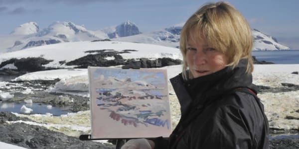 Photo of the artist painting in Antarctica