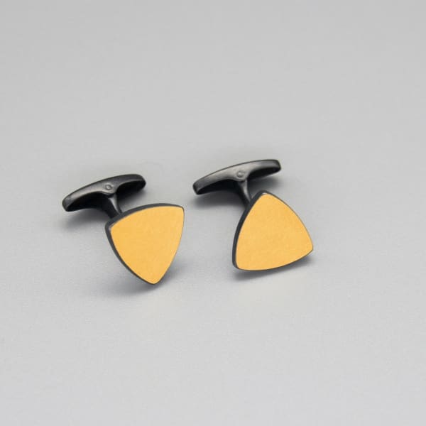 Sheng Zhang 'One on Another' Triangle Keum-boo Cufflinks, 2022 Oxidised sterling silver, 24K gold foil. Face of cufflink: 13 mm x 13 mm x 13 mm 17 mm whale tail fastening