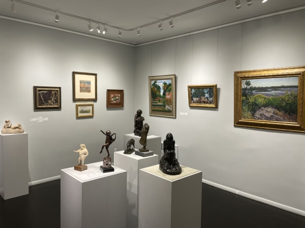 gallery installation with paintings and sculpture