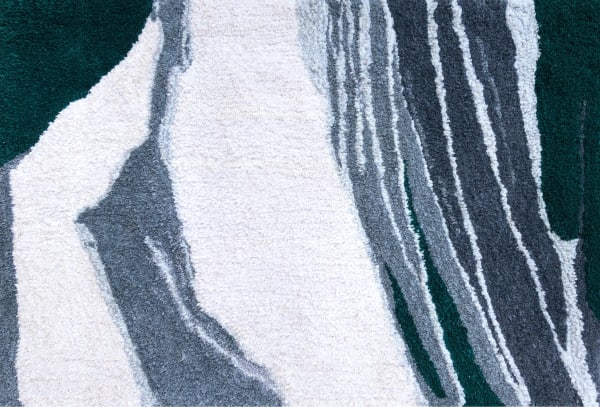 Hand tufted rug of muted abstract landscape