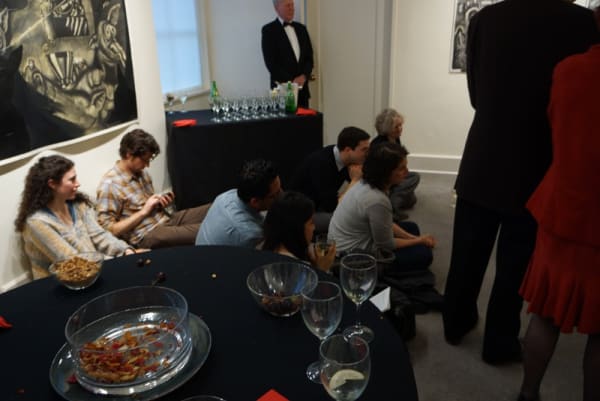 Photograph of visitors crowding the gallery at the opening of the exhibition "Mad as Hell," 2012