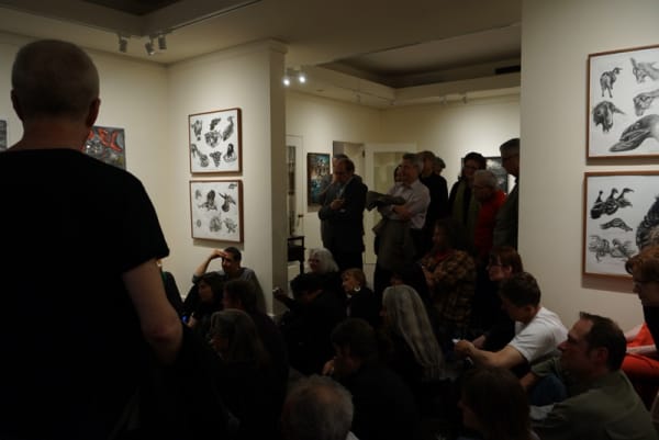 Photograph of visitors crowding the gallery at the opening of the exhibition "Mad as Hell," 2012