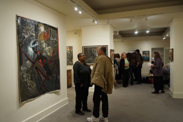 Photograph of visitors at the opening of the exhibition "Mad as Hell," 2012