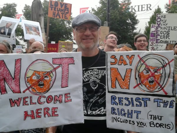 Photograph of a protester wearing a t-shirt emblazoned with an image of Sue Coe's "It Can Happen Here," July 2018 