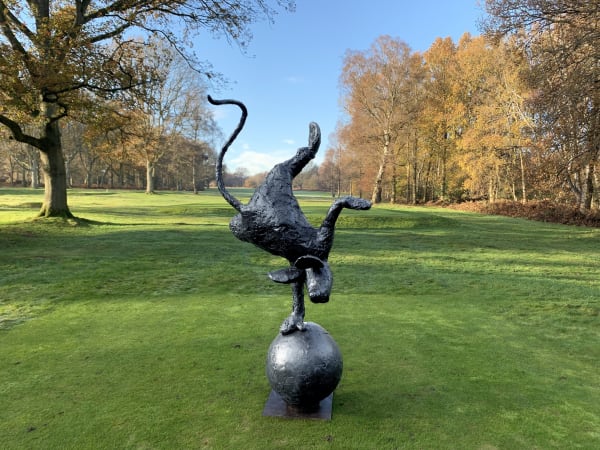 Mouse sculpture handstand on ball garden sculpture