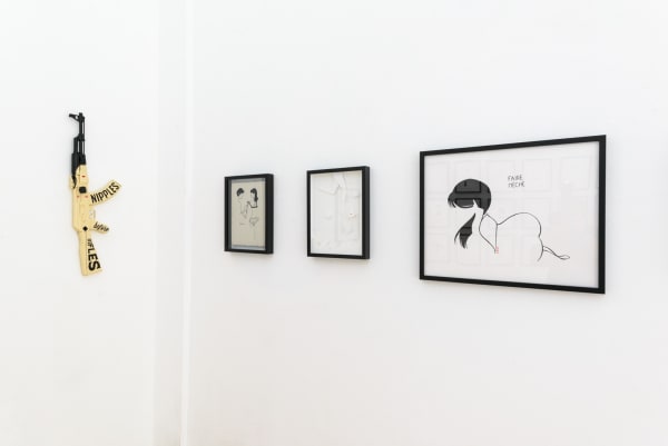 Install photo of framed illustrations by Petite Luxures hung on a wall