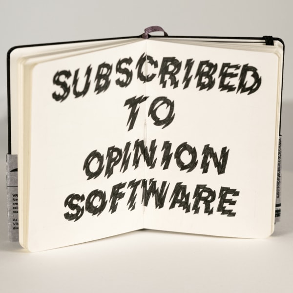 "Subscribed to Opinion Software" written inside notebook