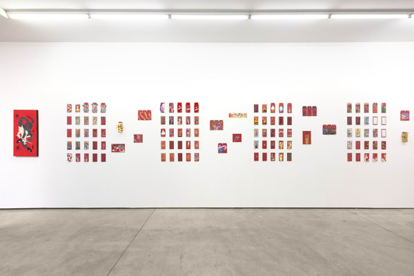 installation photograph of lunar new year red envelopes hung on a white wall 