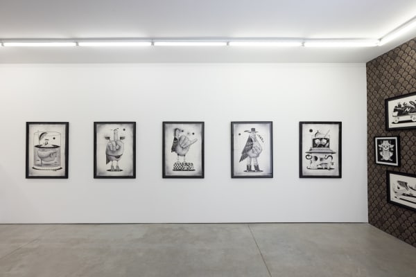 five large black and white illustrations by artist Jeremy Fish on a wall