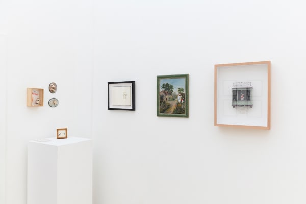 Install photo of framed illustrations by Petite Luxures hung on a wall