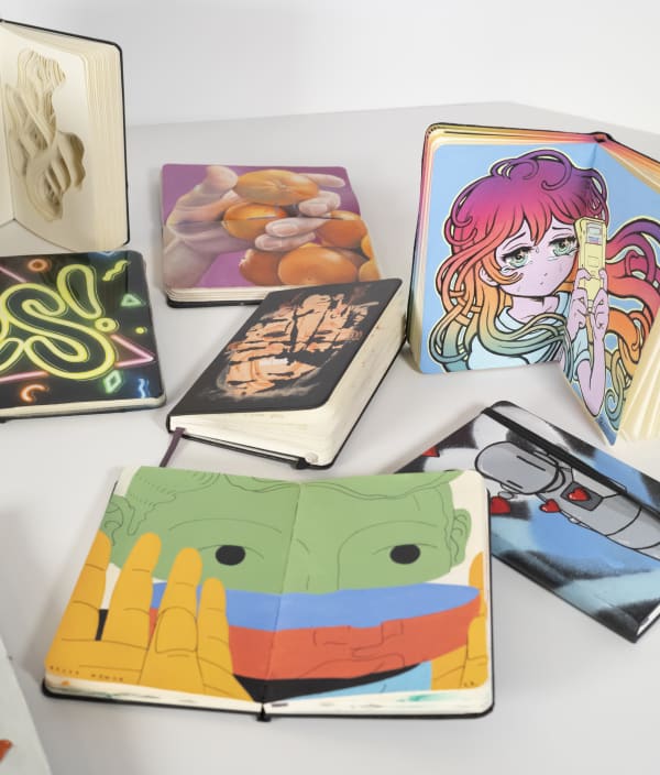 group of colorful moleskine notebooks