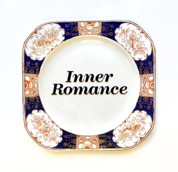 decorative plate with "Inner Romance" written on made by Marie-Claude Marquis