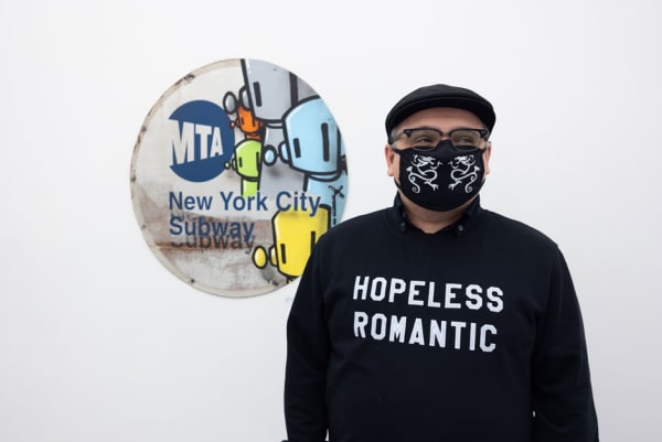 artist ChrisRWK in front of an artwork he made